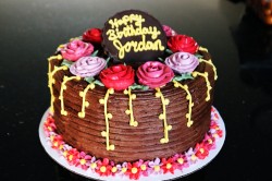 Chocolate birthday cake with pink roses