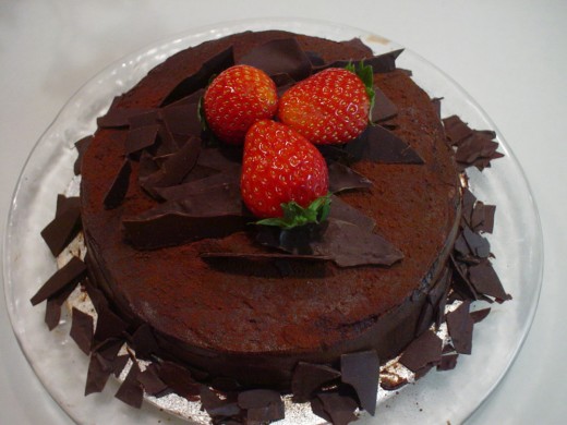 Chocolate birthday cake with strawberries