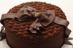 Chocolate birthday cake with ribbon