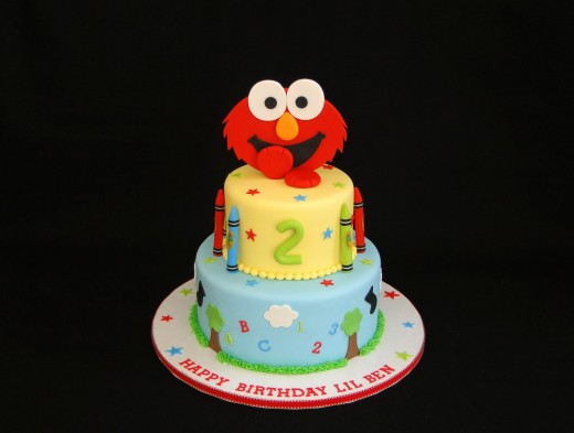 2 tier cake with smiling Elmo