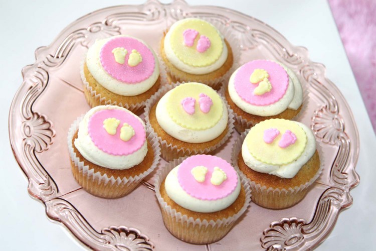 Baby shower cupcakes with feet decorations