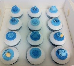 Baby shower cupcakes with blue decorations