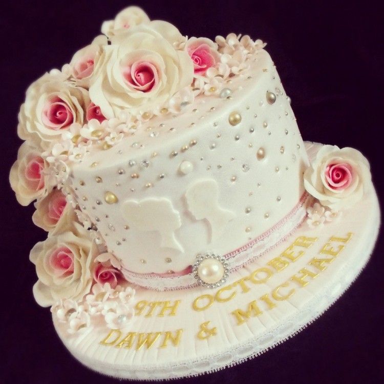 Anniversary cake with pink roses