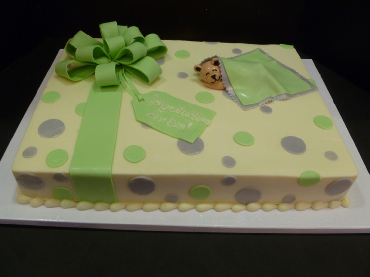 Baby shower cake with green ribbon