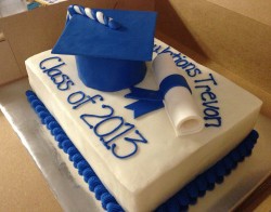 Cake with blue graduation cap