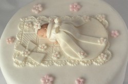 Christening cake with sleeping baby
