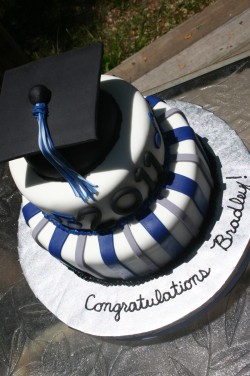 Blue and black graduation cake