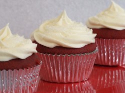 Three red velvet cupcakes