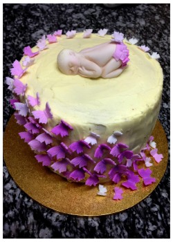 Butterflies and sleaping baby cake