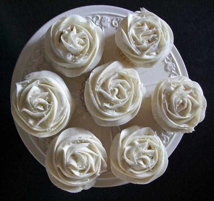Vanilla cupcakes with rose decor