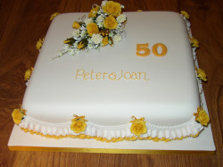 Anniversary cake with yellow roses
