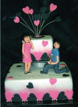 Pink and black hearts engagement cake