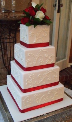 Wedding cake with red ribbon