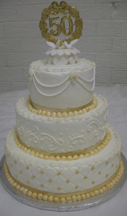 Anniversary cake with gold decoration