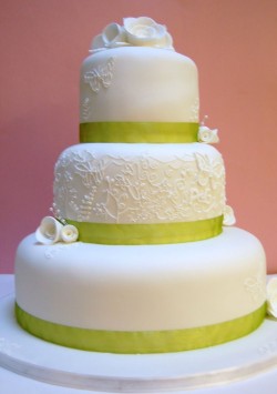 Wedding cake with green ribbon